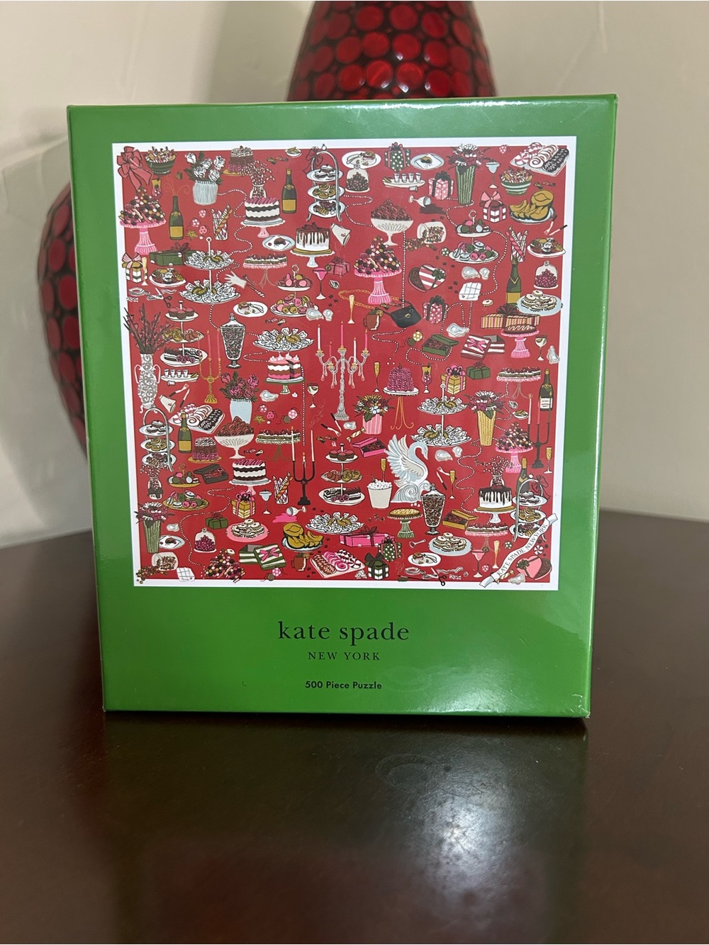 kate spade green box with red illustrated dessert scene puzzle